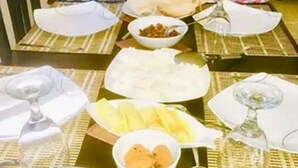 A dining table set with various dishes including rice, soup, and nuts. - Wildshade safari Lodge Udawalawa (Udawalawa)