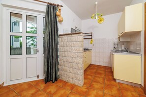 Apartment (A2) | Private kitchen | Fridge, microwave, stovetop, espresso maker - Apartments Mirela (Karlobag)