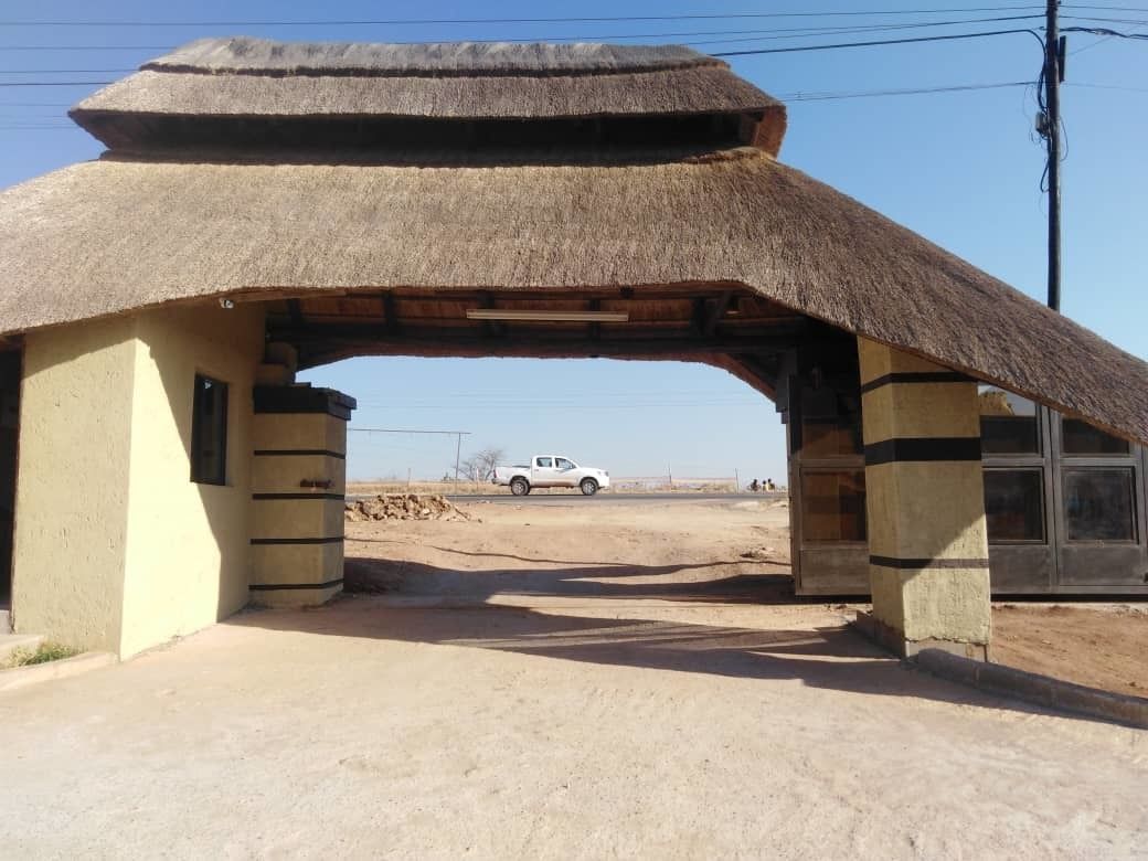 A thatched structure with a flat roof, possibly a traditional or cultural building.