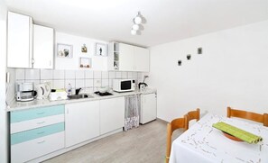 Apartment (A1) | Private kitchen | Fridge, microwave, stovetop, espresso maker