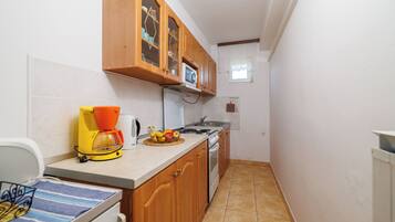 Apartamento (A1) | Cozinha privada | Geladeira, fogão, cooktop, máquina de café expresso