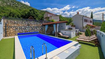 Outdoor pool, a heated pool, pool loungers