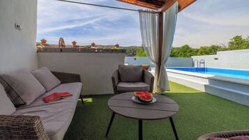 Outdoor pool, a heated pool, pool loungers