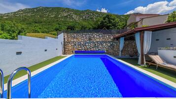 Outdoor pool, a heated pool, sun loungers