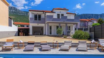 Outdoor pool, pool umbrellas, pool loungers