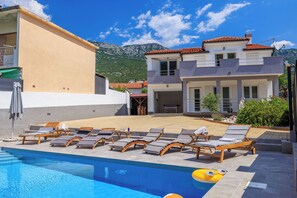 Outdoor pool, pool umbrellas, pool loungers