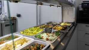 A buffet with various food options including salads, rice dishes, and meats. - Wczasowa 8 Apartments Sarbinowo (Sarbinowo)