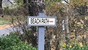 A sign indicating the direction to the beach path. - 2 Bed/2 Bath on 1/4 acre w/fenced yard, short walk to 40th thru rolling dunes. (Nantucket)
