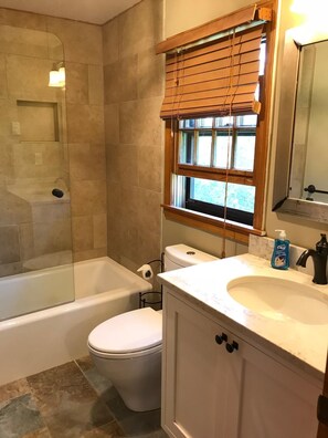 Combined shower/tub, hair dryer, towels, toilet paper
