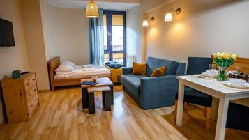 Studio (32A) | Living area | 30-inch flat-screen TV with cable channels, TV, DVD player