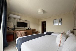Deluxe Room, Multiple Beds, Pool View | Minibar, soundproofing, WiFi (free), bed sheets