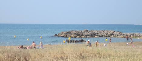 On the beach, sun loungers