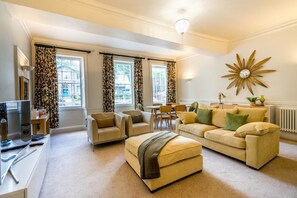 Two-Bedroom Apartment | Living area | Flat-screen TV