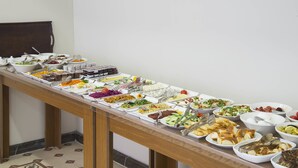 A buffet table with various food items and utensils. - Violin Boutique Hotel (Istanbul)