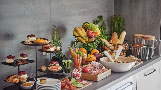 A buffet with various food items including fruits, cheeses, and pastries. - Coffee Inn (Kolbudy)