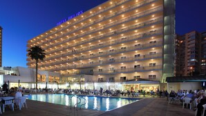 A multi-story hotel with a pool area and outdoor seating. - Helios Benidorm (Benidorm)