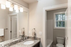 Combined shower/bathtub, hair dryer, towels, soap