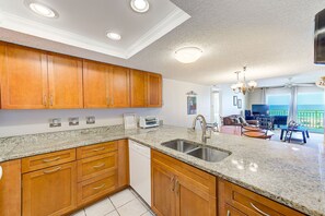 Enjoy meals in this kitchen with a dishwasher, double sink, and dining area.