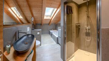Bathtub, hair dryer, towels