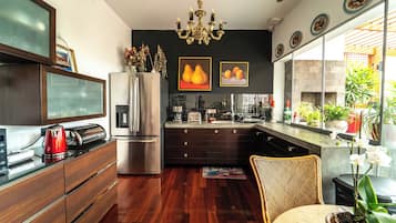 Mini-fridge, microwave, dishwasher, cookware/dishes/utensils
