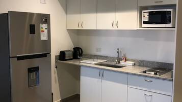 Apartment | Private kitchen | Fridge, microwave, stovetop, coffee/tea maker