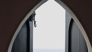 An arched doorway with a view of the sea and a palm tree. - 5 bedroom villa with pool in stunning clifftop location next to gorgeous beach (Rogues Bay)