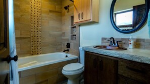 Combined shower/bathtub, hair dryer, towels, soap