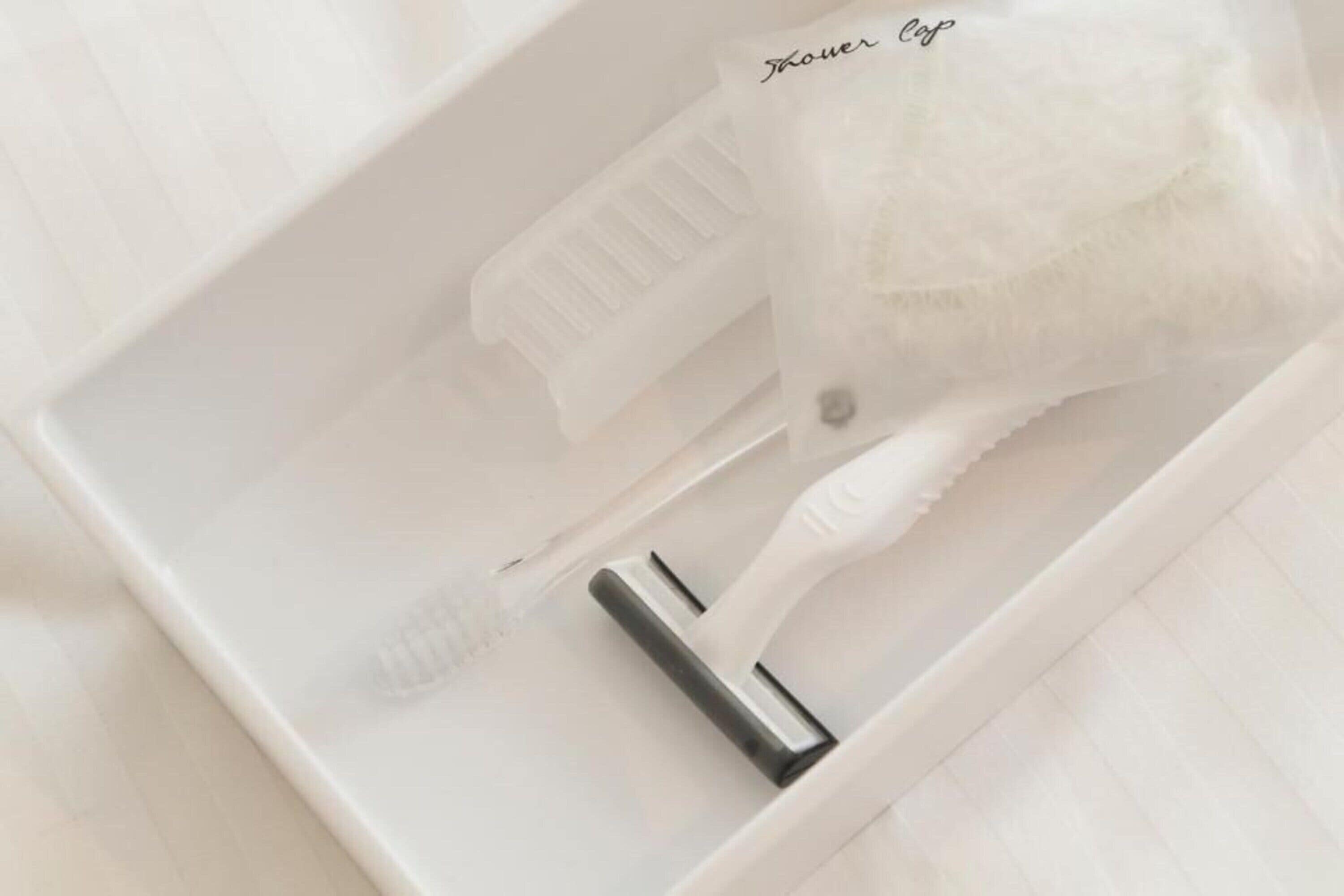 combined shower/bathtub, free toiletries, hair dryer, slippers