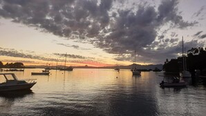 A marina with boats docked under a cloudy sky. - Bay View Barbers Lodge (Savusavu)