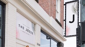 A building with a sign reading "The Jesse Hotel & Bar" and a large 'J' sign above the entrance. - The Jesse Hotel & Bar (Reno)