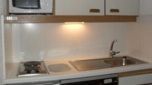 A compact kitchen with a microwave, a sink, and a dishwasher. - Apartment/ flat - ISOLA 2000 (Isola)