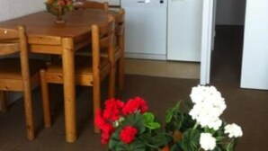 A compact kitchen with white cabinets, a microwave, and a dishwasher. - Apartment/ flat - ISOLA 2000 (Isola)