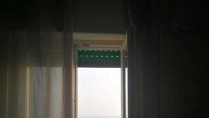 A doorway leading to a balcony with a view of the sea. - Borgo Marinaro (Cetraro)