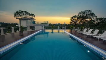 Outdoor pool, open 7:00 AM to 10:00 PM, sun loungers