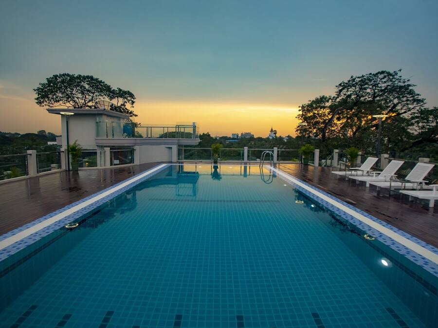Outdoor pool, open 7:00 AM to 10:00 PM, pool loungers