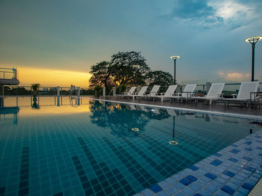 Outdoor pool, open 7:00 AM to 10:00 PM, sun loungers