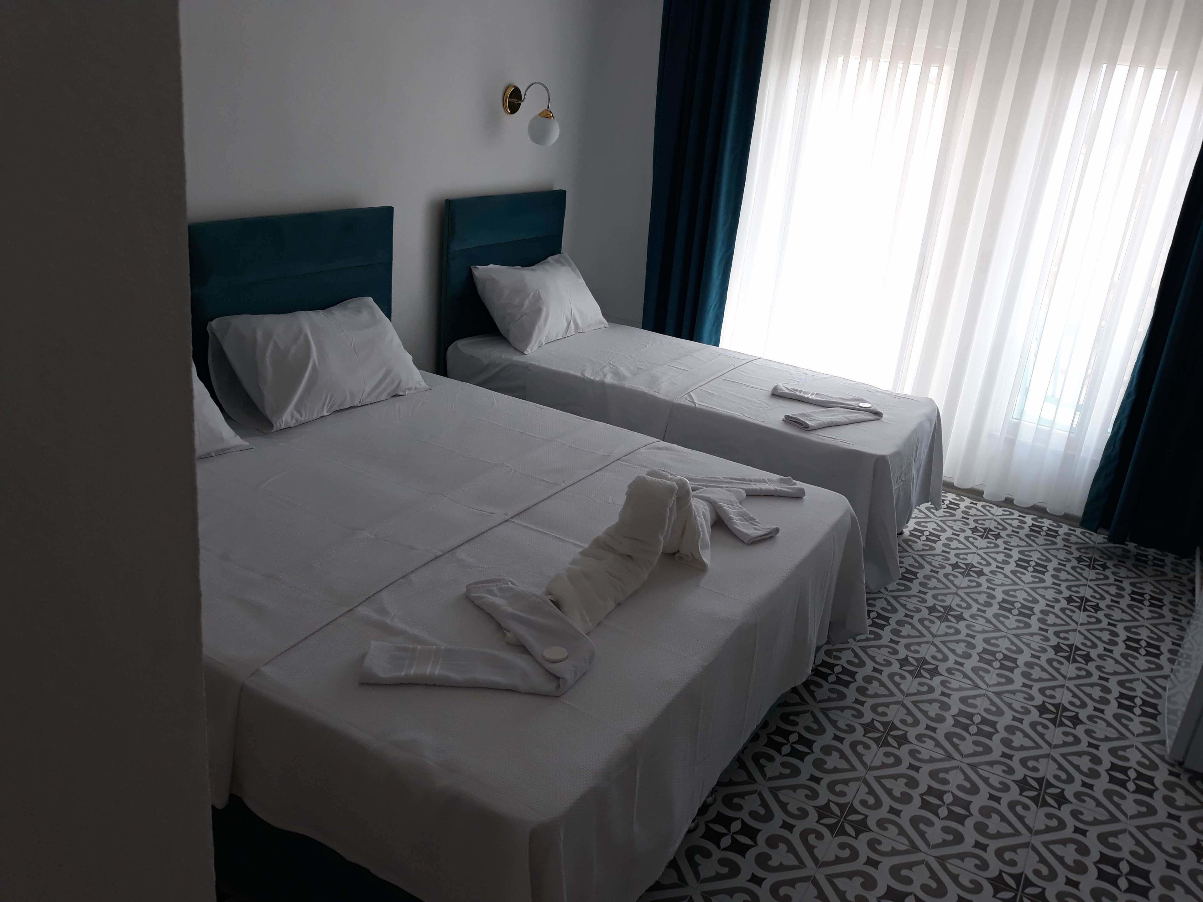 luxury triple room, lanai, sea view | egyptian cotton sheets, premium bedding, down duvets, minibar