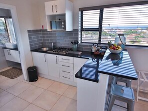 Luxury Apartment (8) | Private kitchen | Fridge, highchair - Jeffreys Bay Luxury Apartments (Jeffreys Bay)