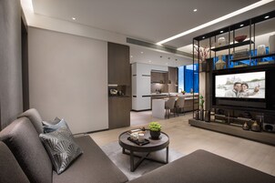 1 Bedroom Premier | Living room | 50-inch TV with cable channels