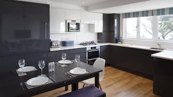 Two-Bedroom Lodge | Private kitchen | Fridge, microwave, oven, stovetop