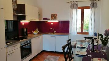 Apartment (A3) | Private kitchen | Espresso maker, fridge, oven, stovetop