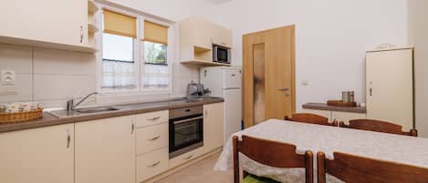 Apartment (A3) | Private kitchen | Fridge, stovetop, espresso maker, electric kettle