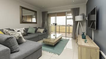 Luxury Apartment | Living area | Flat-screen TV, DVD player