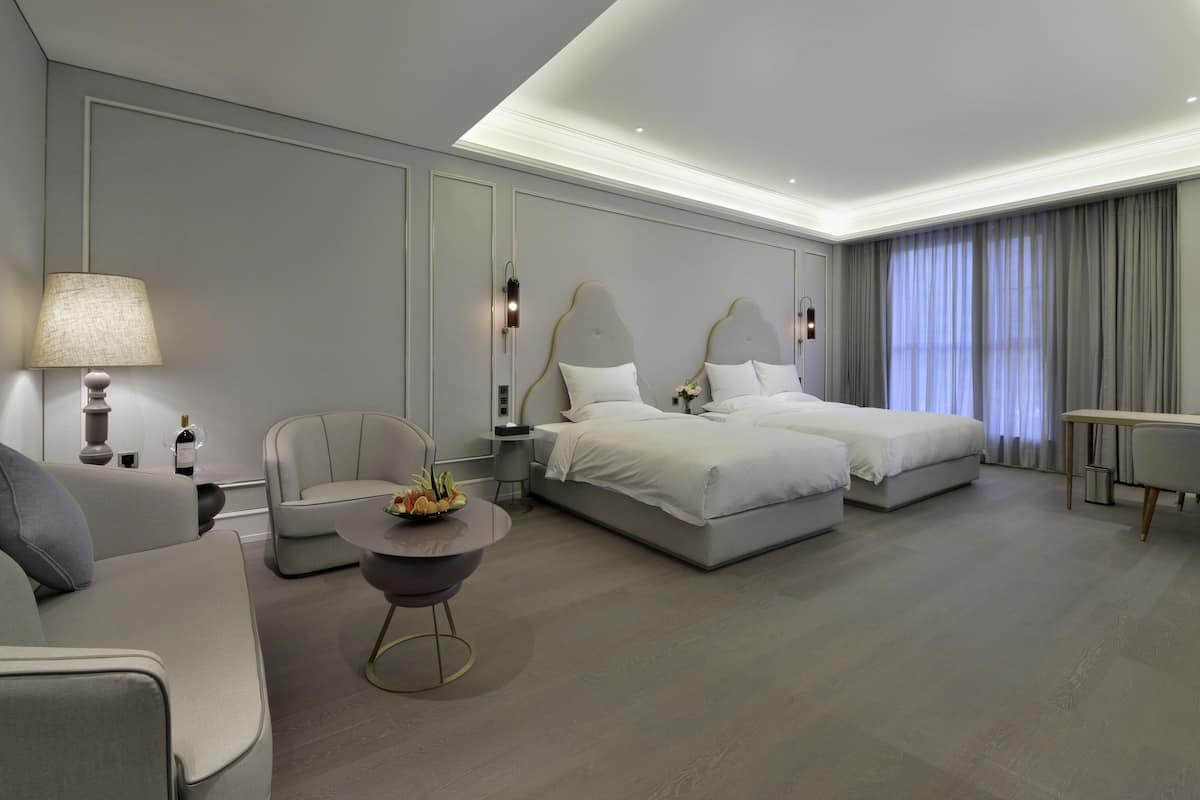 Family Room | Free minibar, in-room safe, desk, blackout drapes