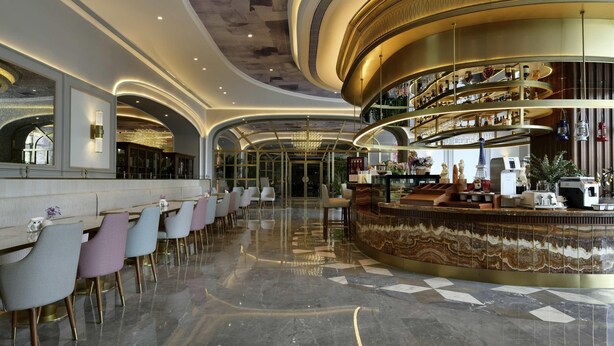 A bar area with a curved counter and seating. - Mercure Taiyuan Jinyang (Taiyuan)