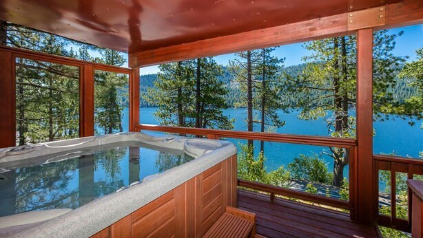 A hot tub on a wooden deck with a lake view. - Paradise Awaits - Updated Donner Lake Home, Private Hot Tub, Dog Friendly, BBQ and Big Deck (Truckee)