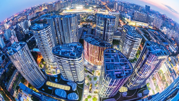 A high-rise urban area with modern architecture, including cylindrical and rectangular buildings, and a central round structure. - BEI Zhaolong Hotel, part of JdV by Hyatt (Beijing)