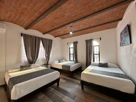 Family Room, Multiple Beds | Premium bedding, in-room safe, laptop workspace, blackout drapes