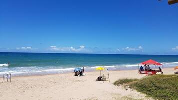 On the beach, white sand, 2 beach bars