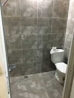 Shower, hydromassage showerhead, hair dryer, towels